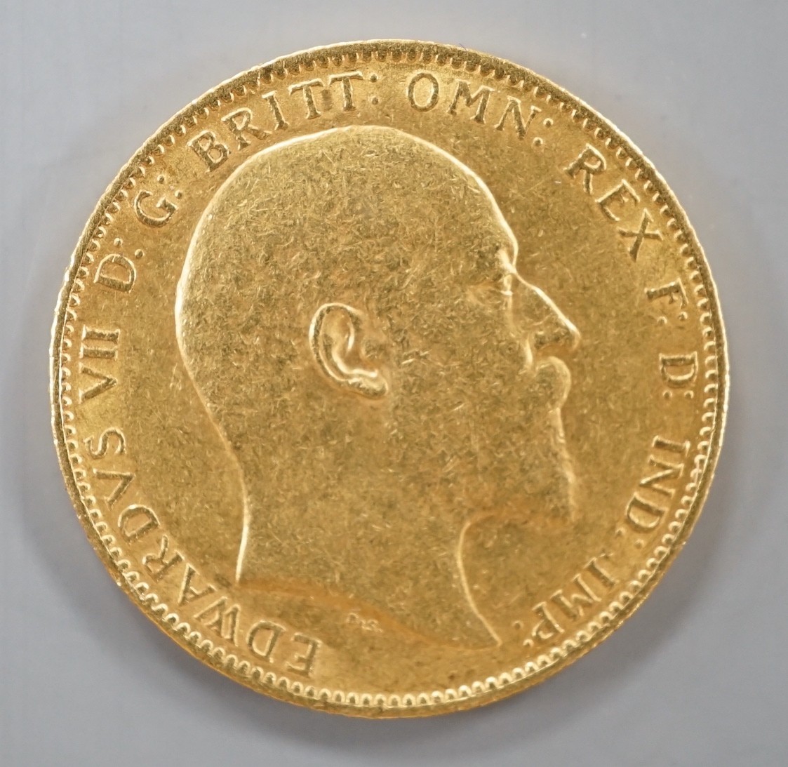 An Edward VII 1903 gold sovereign.
